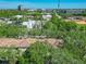 Community aerial view showcasing well-maintained landscaping, city views, and nearby commercial buildings at 2329 Shadow View Cir # 2329, Maitland, FL 32751