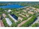 Expansive aerial view shows the community beside a lake, with lush landscaping and beautiful residences at 2329 Shadow View Cir # 2329, Maitland, FL 32751