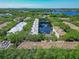 Beautiful aerial view of the community with a pond and fountain surrounded by lush green trees at 2329 Shadow View Cir # 2329, Maitland, FL 32751