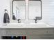 Bathroom vanity with double sinks, modern fixtures and gray cabinets with gold hardware at 2329 Shadow View Cir # 2329, Maitland, FL 32751
