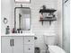 Updated bathroom with black accents, white vanity, and a contemporary design at 2329 Shadow View Cir # 2329, Maitland, FL 32751