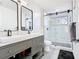Bathroom features a double vanity, modern fixtures, and a glass shower with a geometric window at 2329 Shadow View Cir # 2329, Maitland, FL 32751