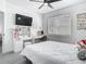 Well-lit bedroom with a vanity desk, large window and a comfortable bed with soft, inviting bedding at 2329 Shadow View Cir # 2329, Maitland, FL 32751