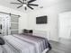Bright bedroom with a ceiling fan, closet, and sleek minimalist furniture at 2329 Shadow View Cir # 2329, Maitland, FL 32751