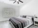 Bedroom with a ceiling fan, a large window, and sleek minimalist furniture at 2329 Shadow View Cir # 2329, Maitland, FL 32751
