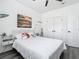 Cozy bedroom with a white color scheme, simple decor and a full-size bed with soft bedding at 2329 Shadow View Cir # 2329, Maitland, FL 32751