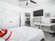 Comfortable bedroom with a spacious closet, vanity, and large bed with plush pillows and a soft comforter at 2329 Shadow View Cir # 2329, Maitland, FL 32751