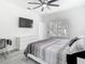 Bedroom with a ceiling fan, large window, desk, and a minimalist dresser at 2329 Shadow View Cir # 2329, Maitland, FL 32751