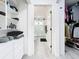 Walk-in closet with an ensuite bathroom featuring a glass shower and modern finishes at 2329 Shadow View Cir # 2329, Maitland, FL 32751