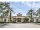 Charming clubhouse with elegant columns, arched windows, and meticulously maintained landscaping at 2329 Shadow View Cir # 2329, Maitland, FL 32751