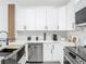 Kitchen with stainless steel dishwasher and oven with white countertops and cabinets at 2329 Shadow View Cir # 2329, Maitland, FL 32751