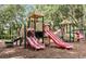 Community playground with multiple slides, climbing structures, and a soft landing surface at 2329 Shadow View Cir # 2329, Maitland, FL 32751