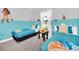 Charming ' bedroom with two twin beds, blue accents, and playful character decorations at 235 Villa Domani Cir, Davenport, FL 33896