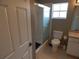 A clean bathroom features a shower, toilet, and vanity at 236 Ridge View Dr, Davenport, FL 33837