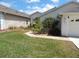 Well-maintained home featuring a green lawn and manicured landscaping at 236 Ridge View Dr, Davenport, FL 33837