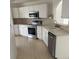 Well-equipped kitchen with stainless steel appliances and light countertops at 236 Ridge View Dr, Davenport, FL 33837