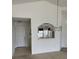 View into kitchen with white cabinets, breakfast bar, and kitchen dining area at 236 Ridge View Dr, Davenport, FL 33837