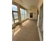 The lanai features neutral tile floors and many windows at 236 Ridge View Dr, Davenport, FL 33837