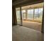 The interior view looks onto the tiled lanai with ceiling fan at 236 Ridge View Dr, Davenport, FL 33837
