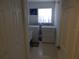 Dedicated laundry room with washer, dryer, and utility sink for convenience at 236 Ridge View Dr, Davenport, FL 33837