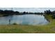 Scenic pond view, reflecting the sky, adds natural beauty to the property at 236 Ridge View Dr, Davenport, FL 33837