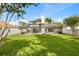 Spacious backyard featuring a covered lanai, lush green grass, and privacy fencing for outdoor enjoyment at 239 Longhirst Loop, Ocoee, FL 34761