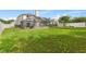 Vast backyard featuring a large lawn and enclosed pool area, great for outdoor activities at 239 Longhirst Loop, Ocoee, FL 34761