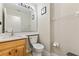 Cozy bathroom with a toilet and vanity and neutral wall color, along with decor at 239 Longhirst Loop, Ocoee, FL 34761
