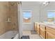 Bathroom featuring a tiled shower, bathtub, and double sink vanity at 239 Longhirst Loop, Ocoee, FL 34761