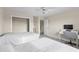Neutral bedroom featuring two beds, a ceiling fan, and desk at 239 Longhirst Loop, Ocoee, FL 34761