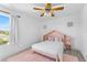 Adorable bedroom with cute decor, a ceiling fan and plenty of natural light at 239 Longhirst Loop, Ocoee, FL 34761