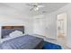 Comfortable bedroom with a ceiling fan and ample closet space at 239 Longhirst Loop, Ocoee, FL 34761
