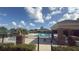 Gated community pool area with a pool, clubhouse, and lounging area for residents to relax and socialize at 239 Longhirst Loop, Ocoee, FL 34761