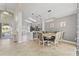 Dining room showcasing stylish lighting and direct access to the kitchen for a cohesive dining experience at 239 Longhirst Loop, Ocoee, FL 34761