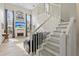 Bright living room featuring a fireplace, large windows, tall ceilings, a staircase and tile floors at 239 Longhirst Loop, Ocoee, FL 34761