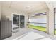 Covered patio with a glimpse of the yard provides a nice outdoor living space at 239 Longhirst Loop, Ocoee, FL 34761