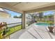 Covered patio leading to a screened-in pool area, perfect for outdoor relaxation at 239 Longhirst Loop, Ocoee, FL 34761