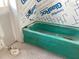 Unfinished bathroom with old green tub awaiting renovation; customize this space to your liking at 2395 Zuni Road, St Cloud, FL 34771
