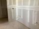 Unfinished bathroom with updated plumbing hookups and newly installed drywall at 2395 Zuni Road, St Cloud, FL 34771