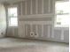 Bedroom ready for personalization with unfinished walls and natural light from two windows at 2395 Zuni Road, St Cloud, FL 34771