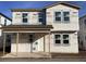 New home construction showing the front of the house with windows and covered porch at 2395 Zuni Road, St Cloud, FL 34771