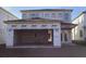 New house exterior with attached garage, and an unfinished yard at 2395 Zuni Road, St Cloud, FL 34771
