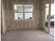 Living room with unfinished walls and outdoor view, waiting for personal design touches at 2395 Zuni Road, St Cloud, FL 34771