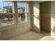 Bright, unfinished room with large window; create your ideal space with natural light at 2395 Zuni Road, St Cloud, FL 34771