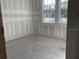 Unfinished room with large windows offering ample natural light, ready for personalization at 2395 Zuni Road, St Cloud, FL 34771