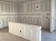 Unfinished room featuring walls with drywall and visible construction, ready for customization at 2395 Zuni Road, St Cloud, FL 34771
