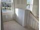 Unfinished stairwell featuring newly installed drywall and bright, modern windows at 2395 Zuni Road, St Cloud, FL 34771