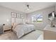 Bright main bedroom with a plush bed, scenic views, and elegant decor at 2457 Cliff Way, St Cloud, FL 34771