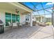 Extensive screened patio offering multiple seating areas, ideal for outdoor entertaining and enjoying lake views at 2457 Cliff Way, St Cloud, FL 34771