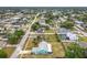 Aerial perspective of the property, revealing its backyard, location, and tree-lined street at 2558 Academy Ave, Deltona, FL 32738